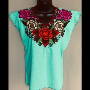Beautiful blue blouse with flower design